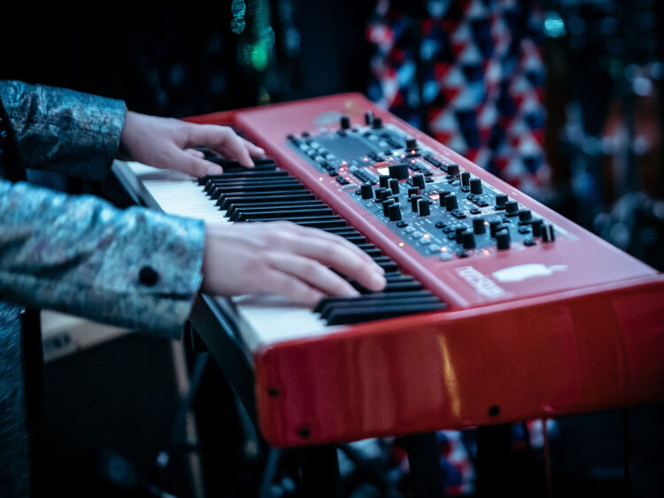 musician playing on a Nord keyboard